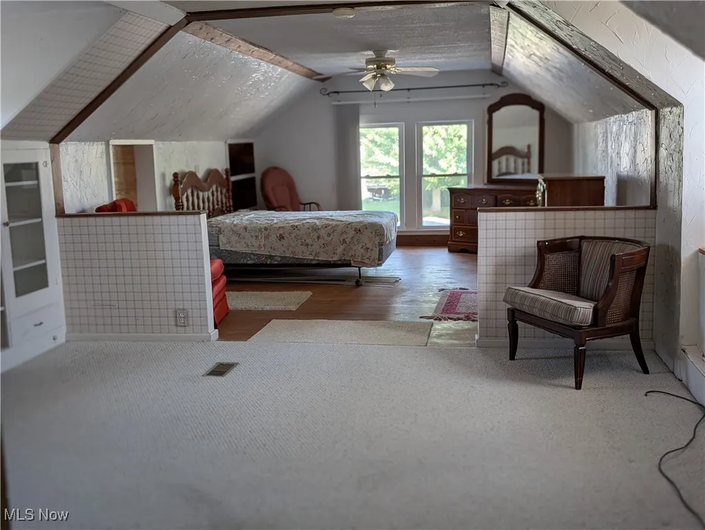 Bedroom upstairs.  This room spans the entire upstairs.  You have a bathroom, 2 closets, sitting area and bedroom area