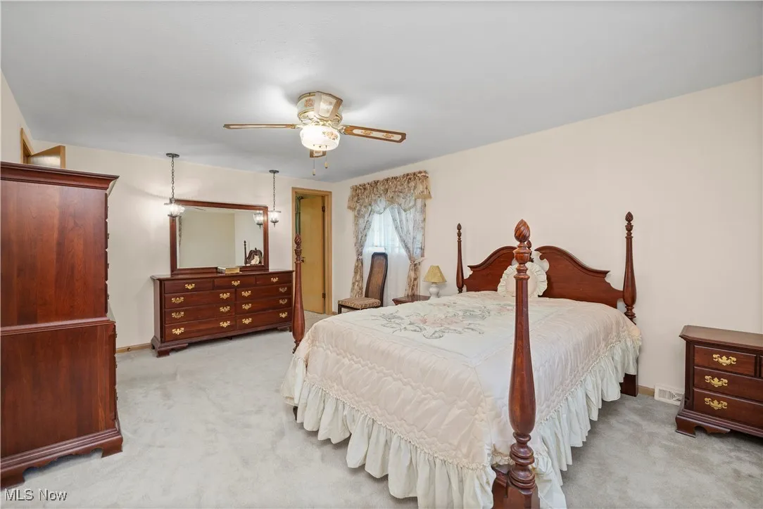 Bedroom with carpet floors and ceiling fan
