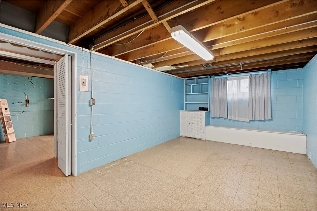 Below grade area featuring tile patterned floors