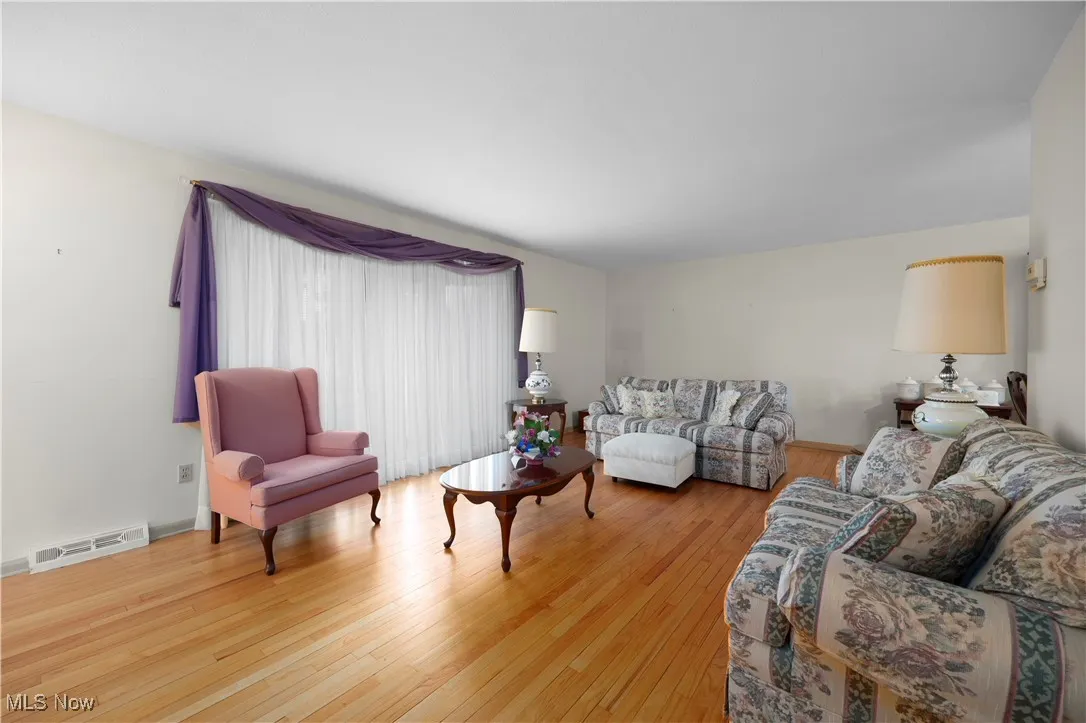 Living room with light wood-style floors