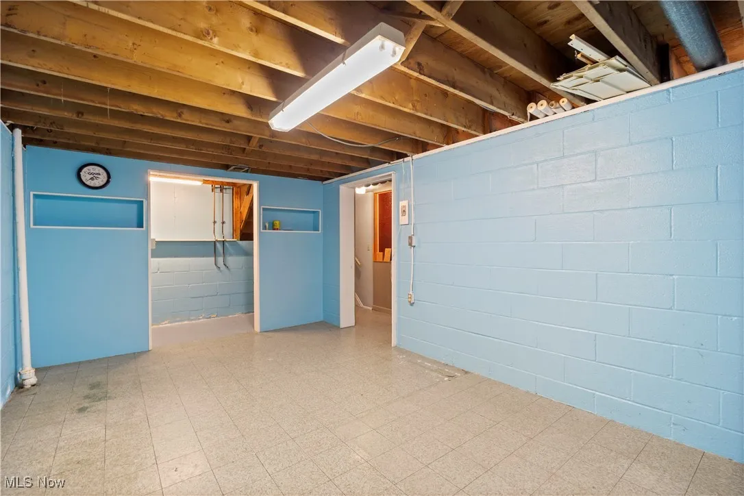 Basement featuring tile patterned floors