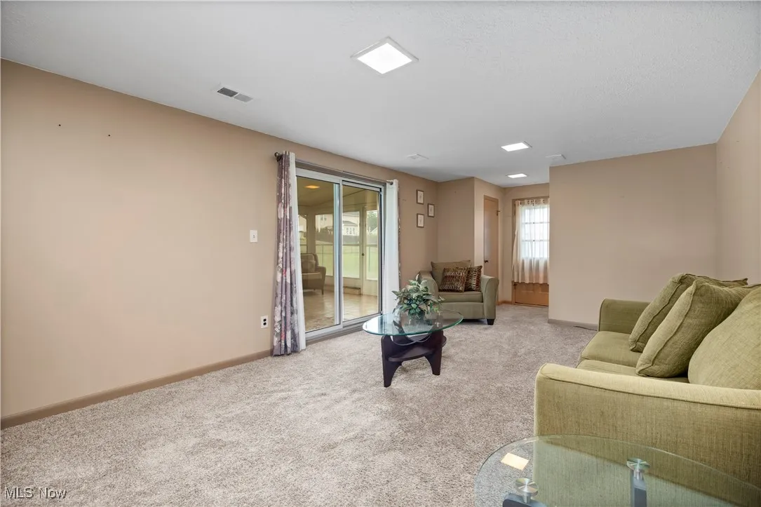 Carpeted family area featuring baseboards
