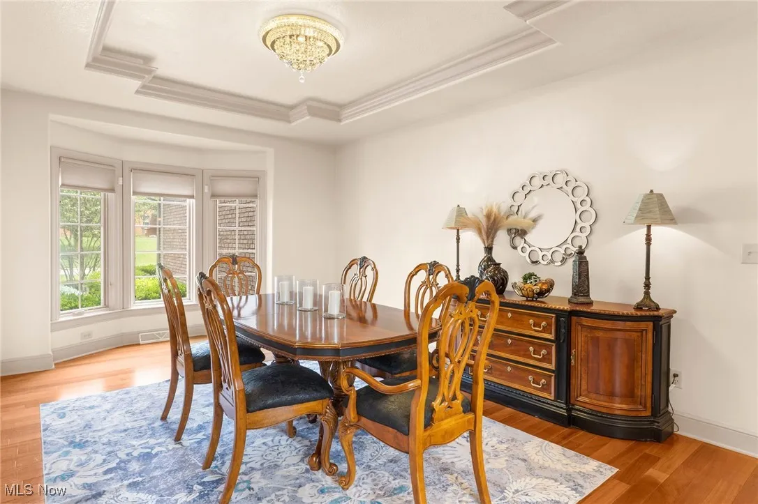 Dining Room featuring hardwood finished floors, a chandelier