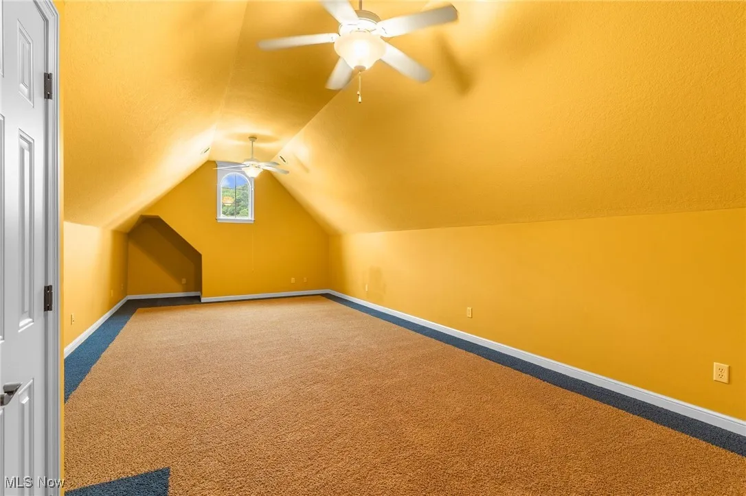 Bedroom with ceiling fan and closet