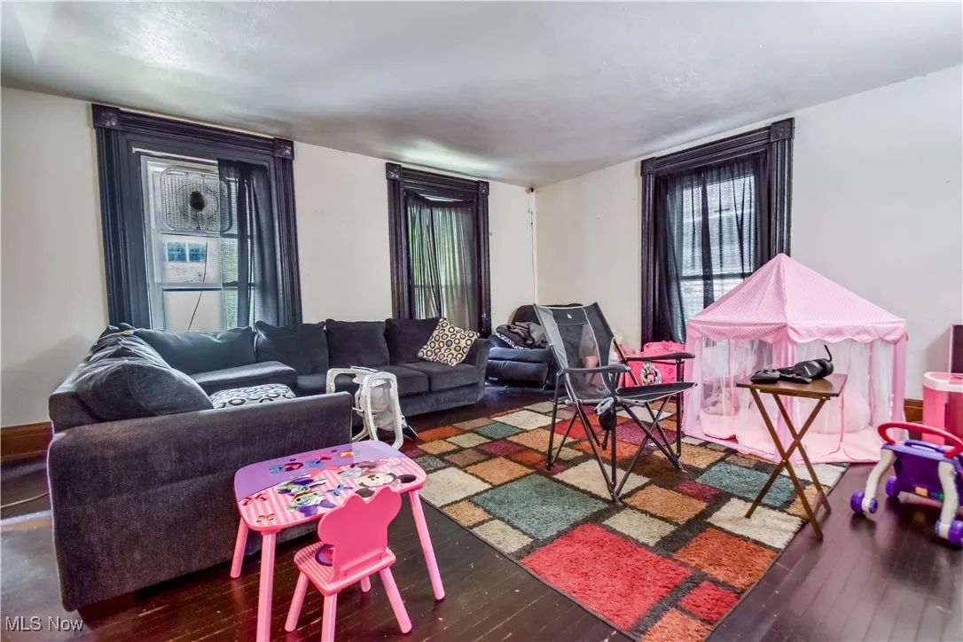 Living room featuring hardwood / wood-style floors and plenty of natural light
