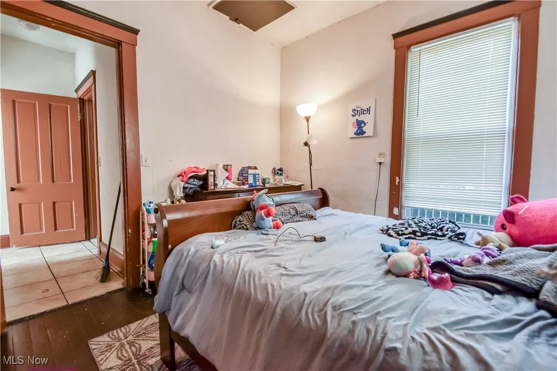 Bedroom with hardwood / wood-style floors