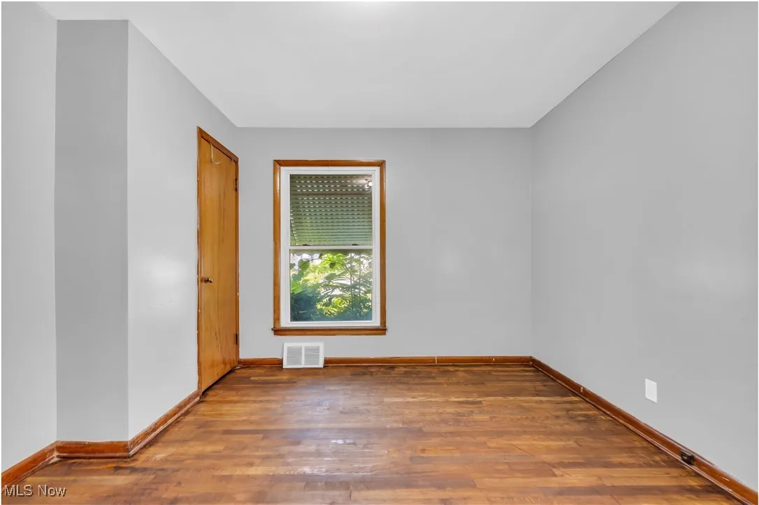 Empty room with wood finished floors