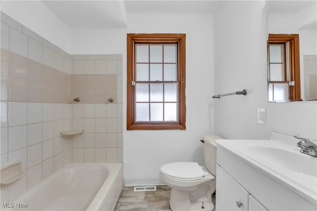 Bathroom with plenty of natural light and vanity