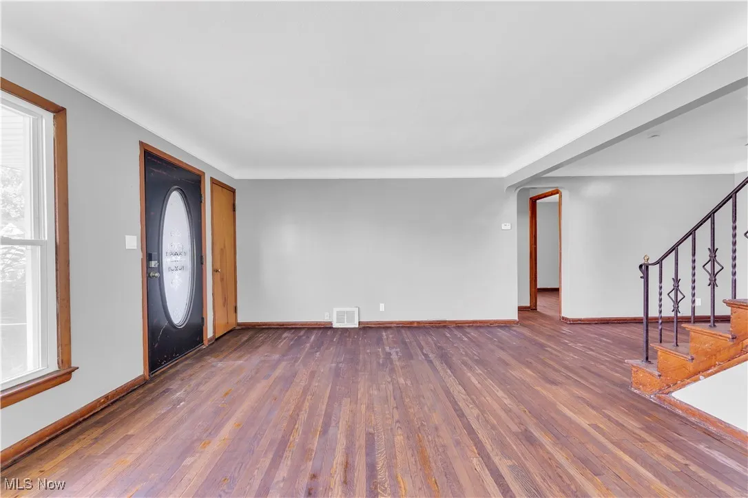 Foyer entrance featuring hardwood / wood-style floors and stairway