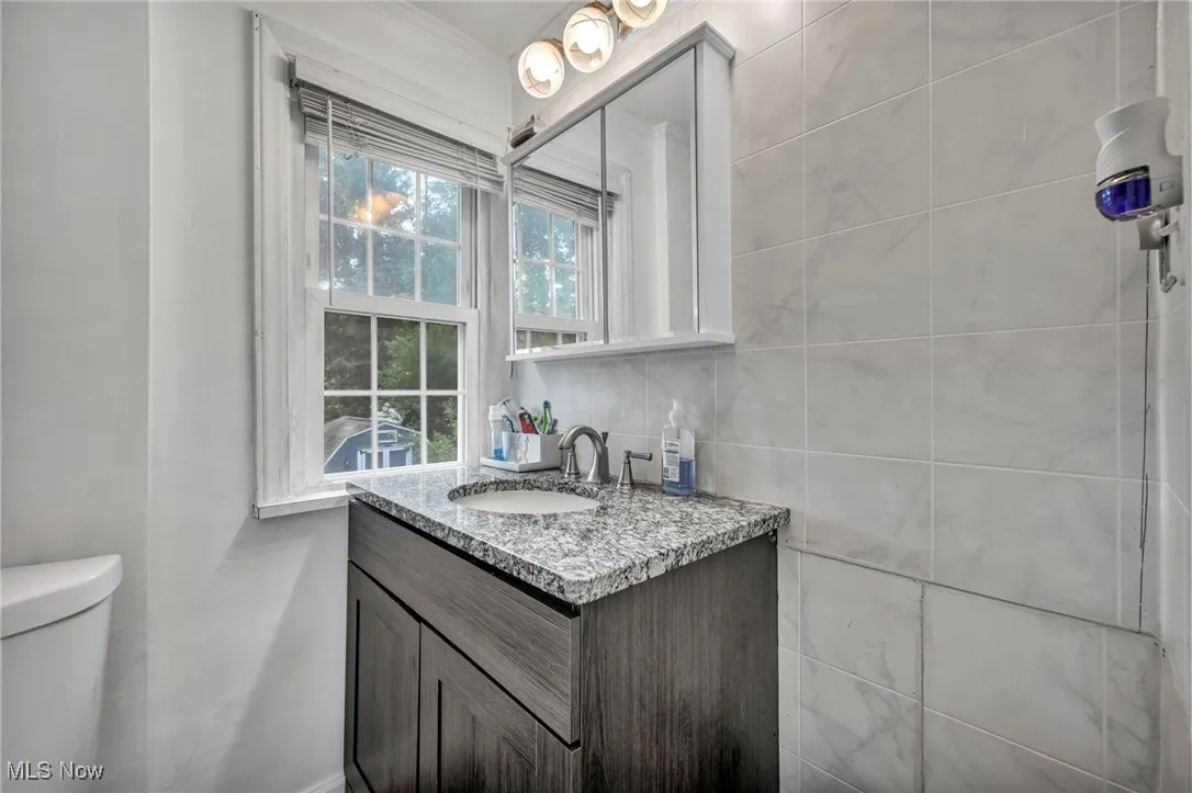 Bathroom with vanity and toilet
