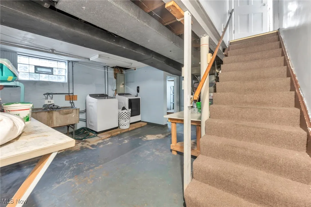 Below grade area with stairway and electric panel