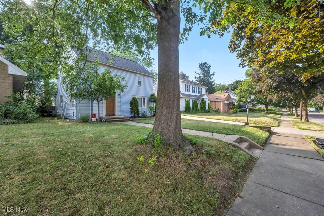 View of front of house with a front yard