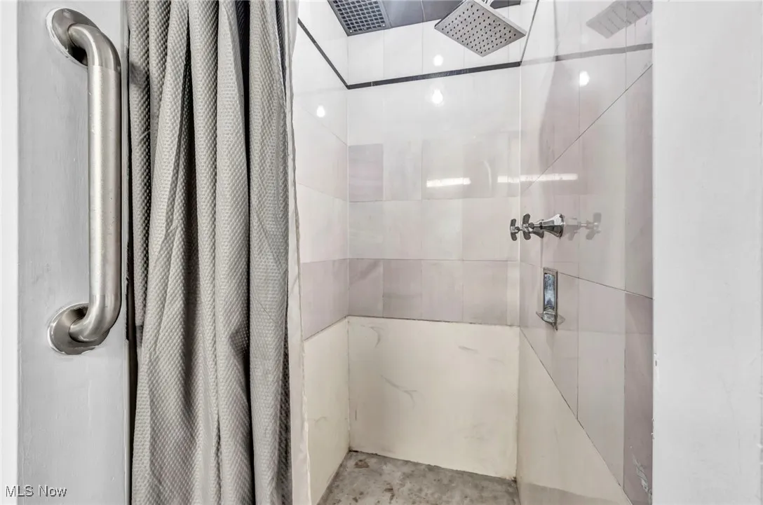 Full bath with a shower with curtain