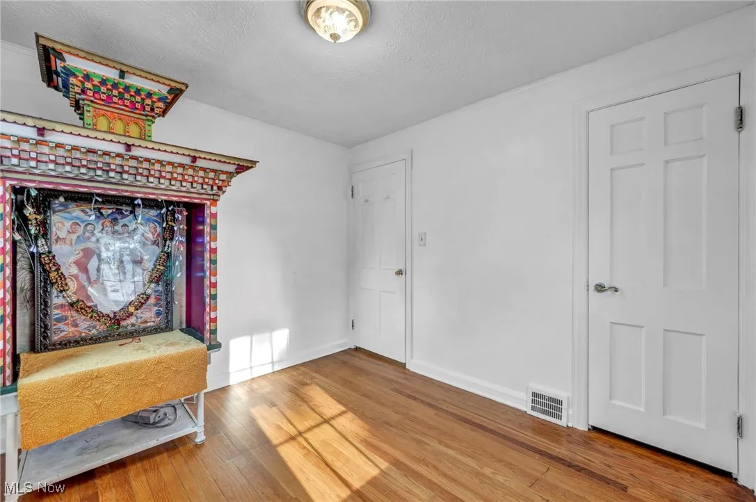 Entryway featuring wood finished floors and a textured ceiling