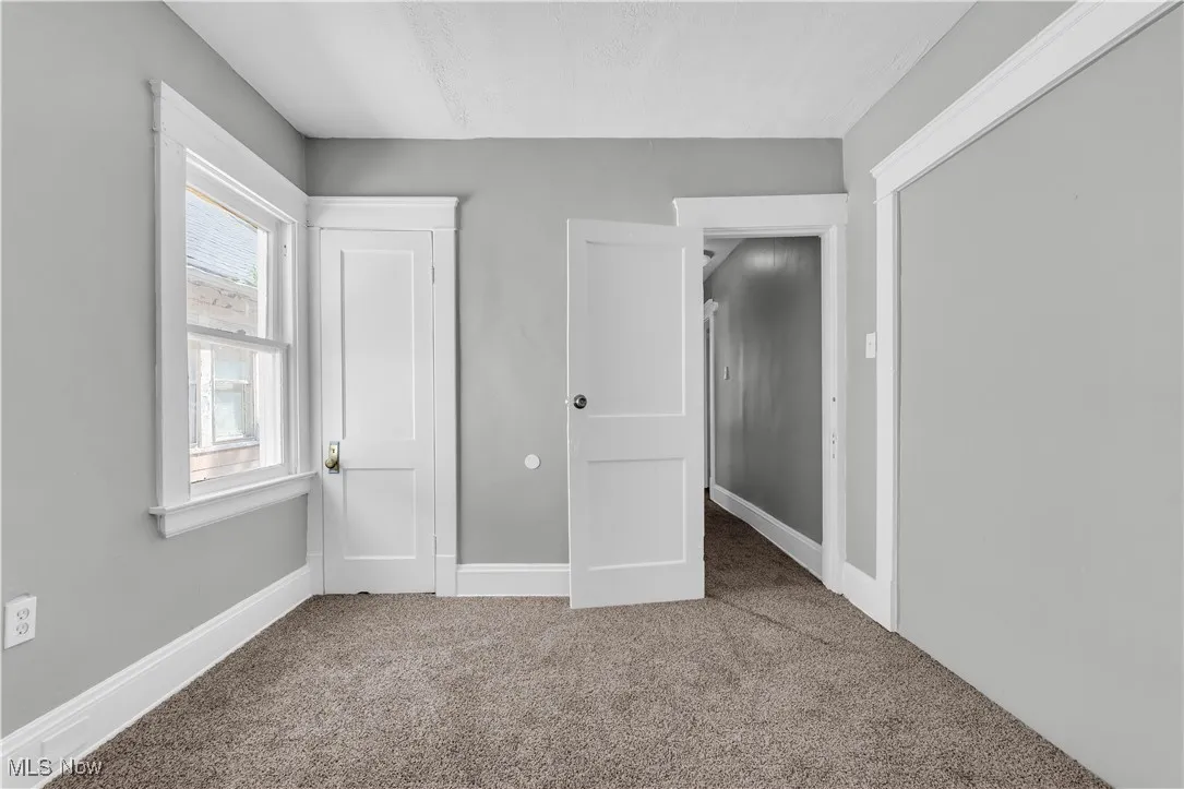Unfurnished bedroom with carpet floors and a closet