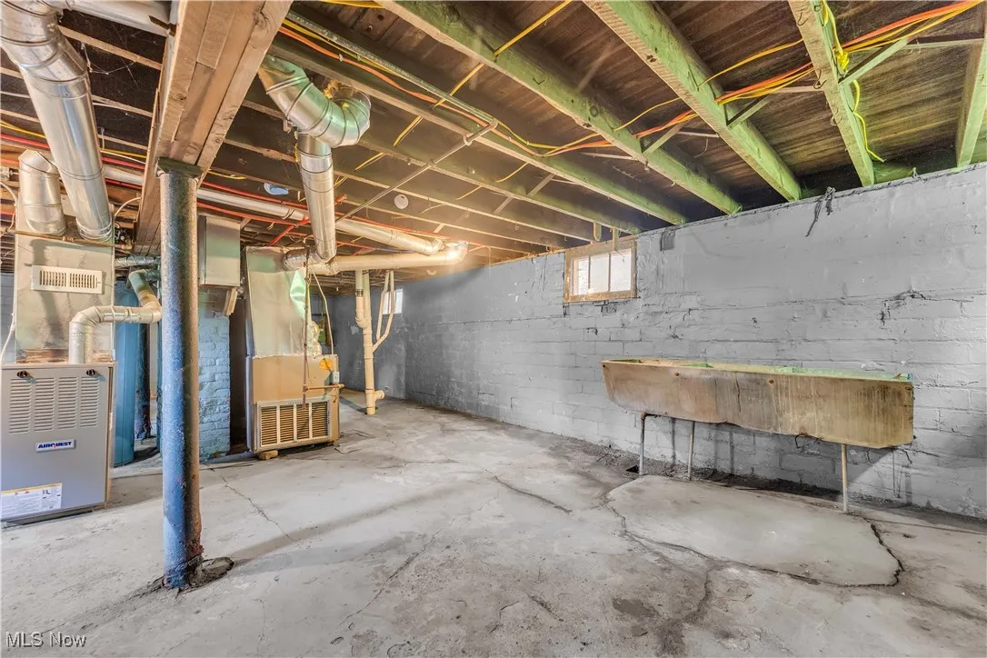 Below grade area featuring heating unit