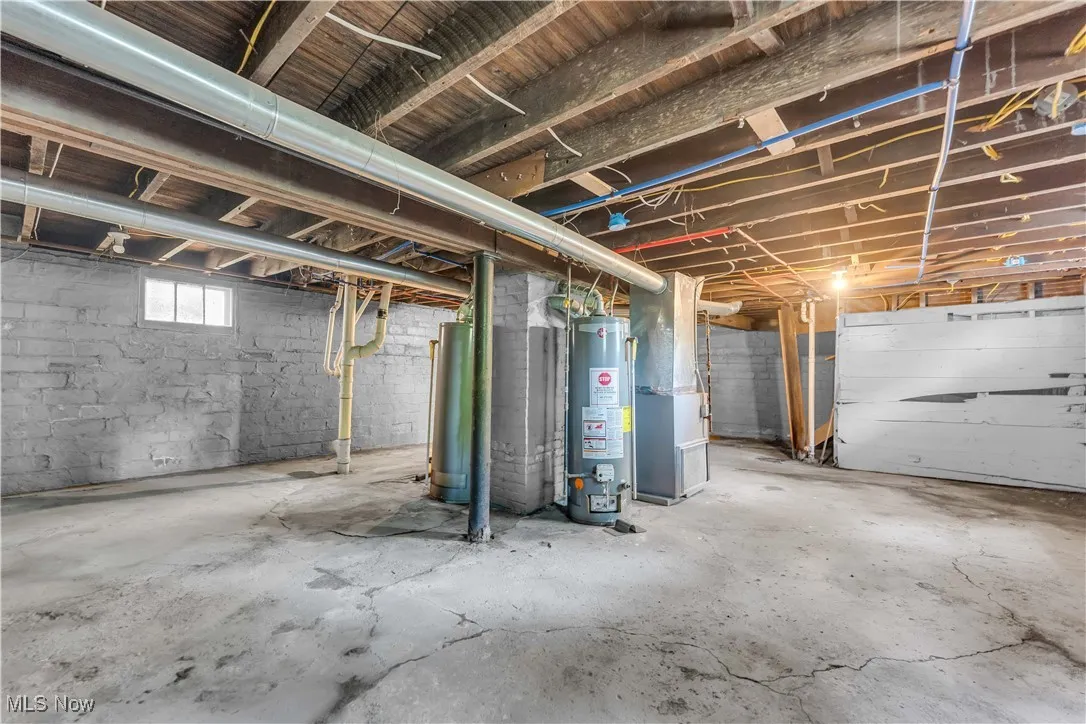Below grade area with water heater and heating unit