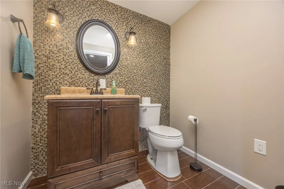 Bathroom featuring vanity and tile walls