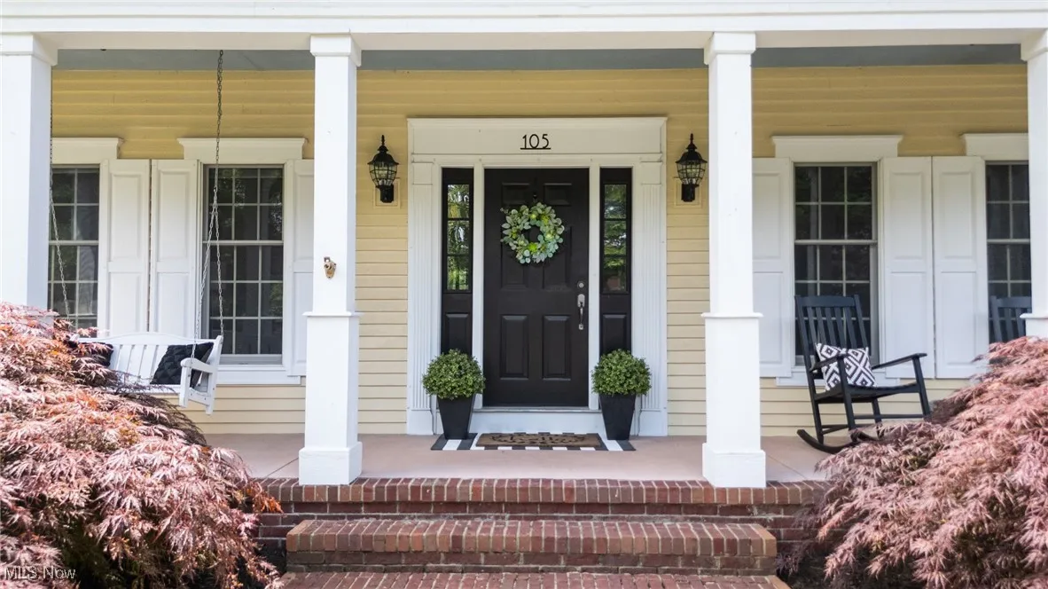 Entrance to property featuring a porch