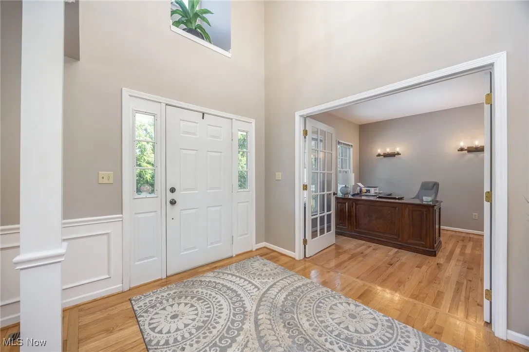 Entryway featuring light hardwood floors and french doors