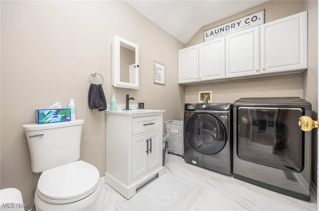 Laundry room featuring washer and clothes dryer