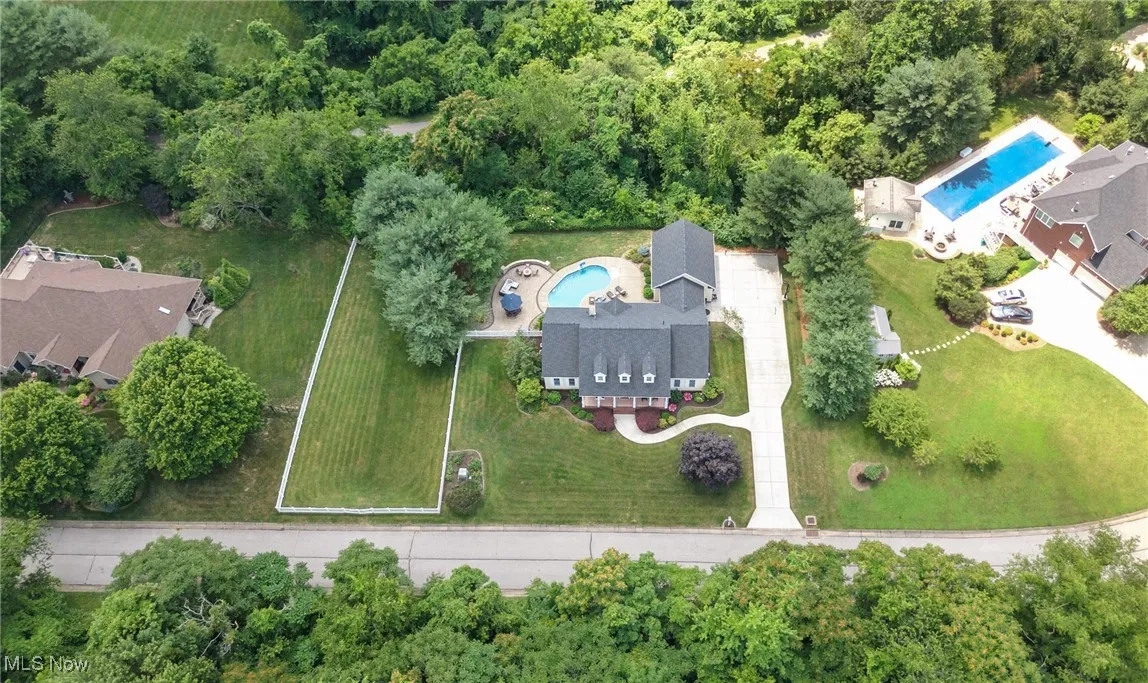 Aerial overview of property's location with a pool area