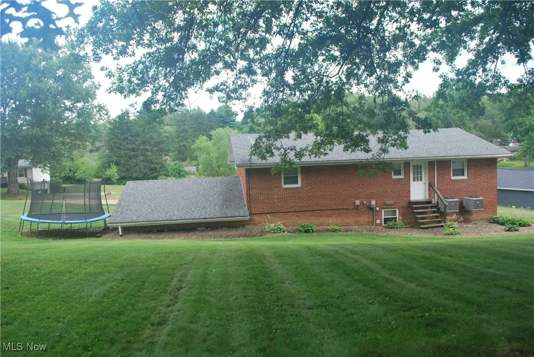 Back of house featuring entry steps
