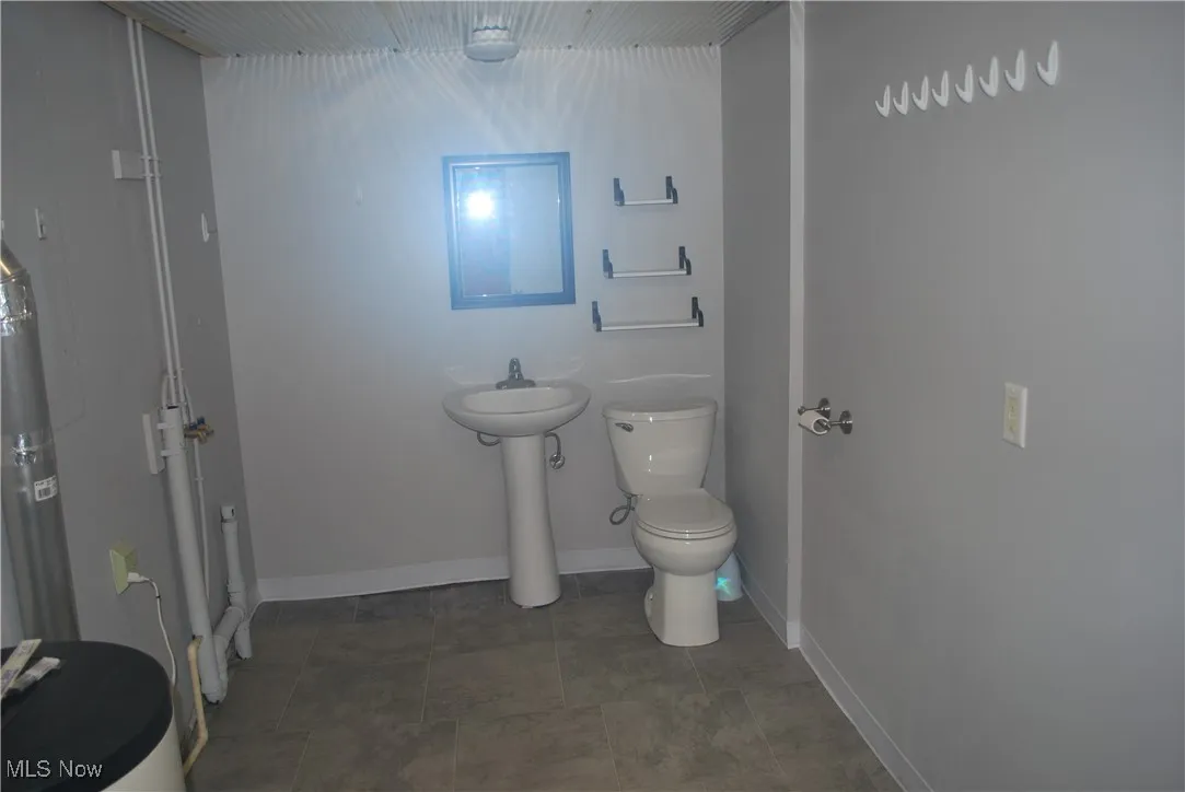 Half bath in laundry-utility room