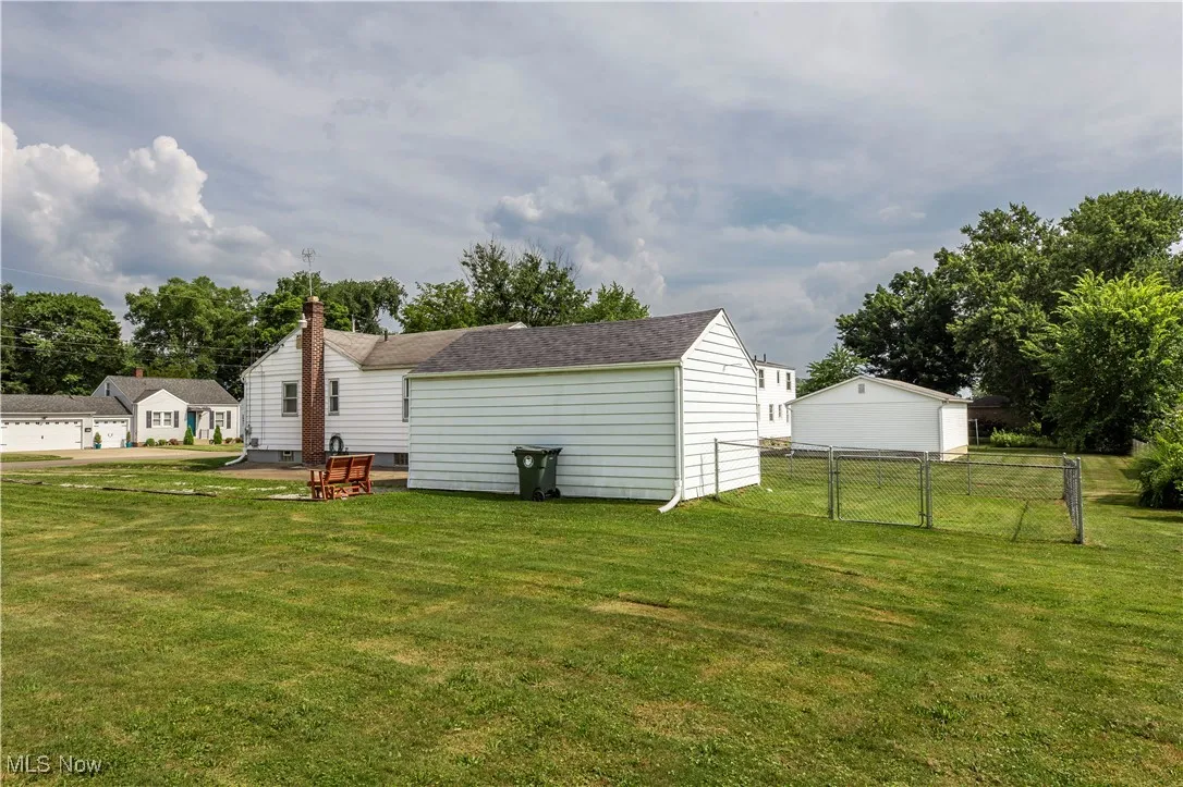 View of yard featuring a garage