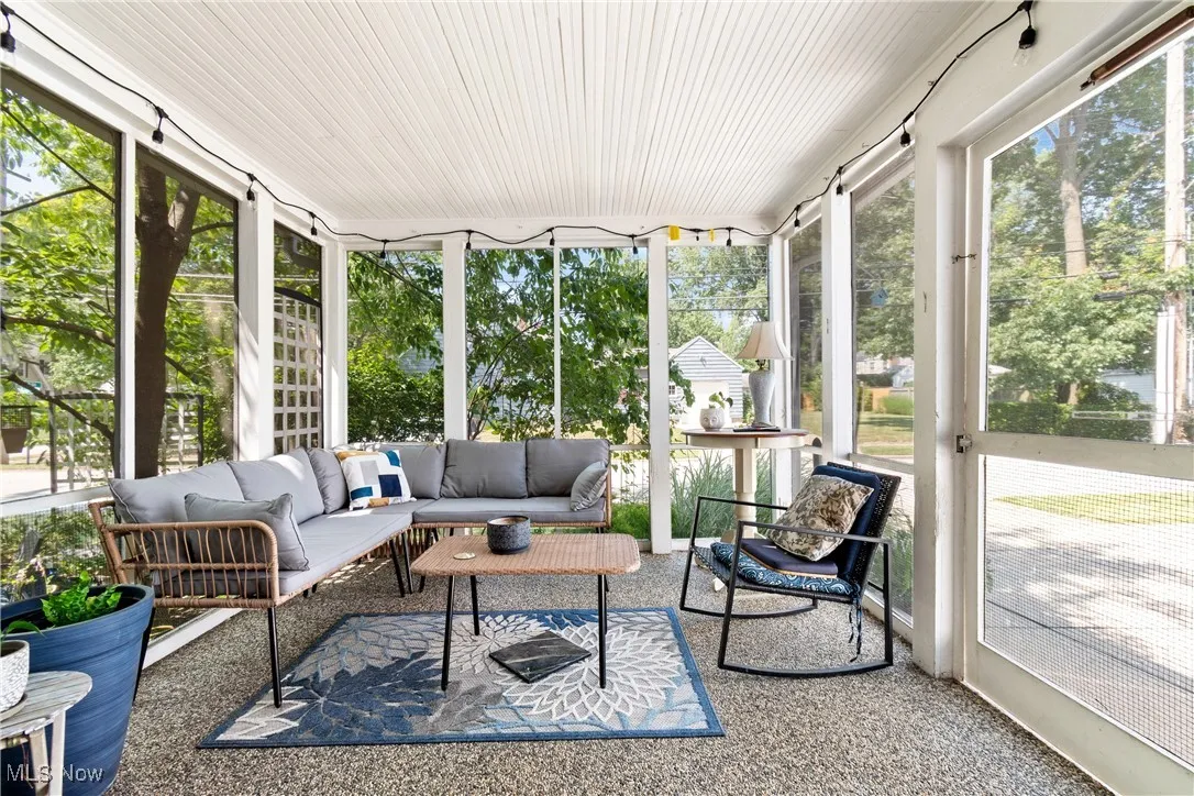 Sunroom featuring an outdoor living space