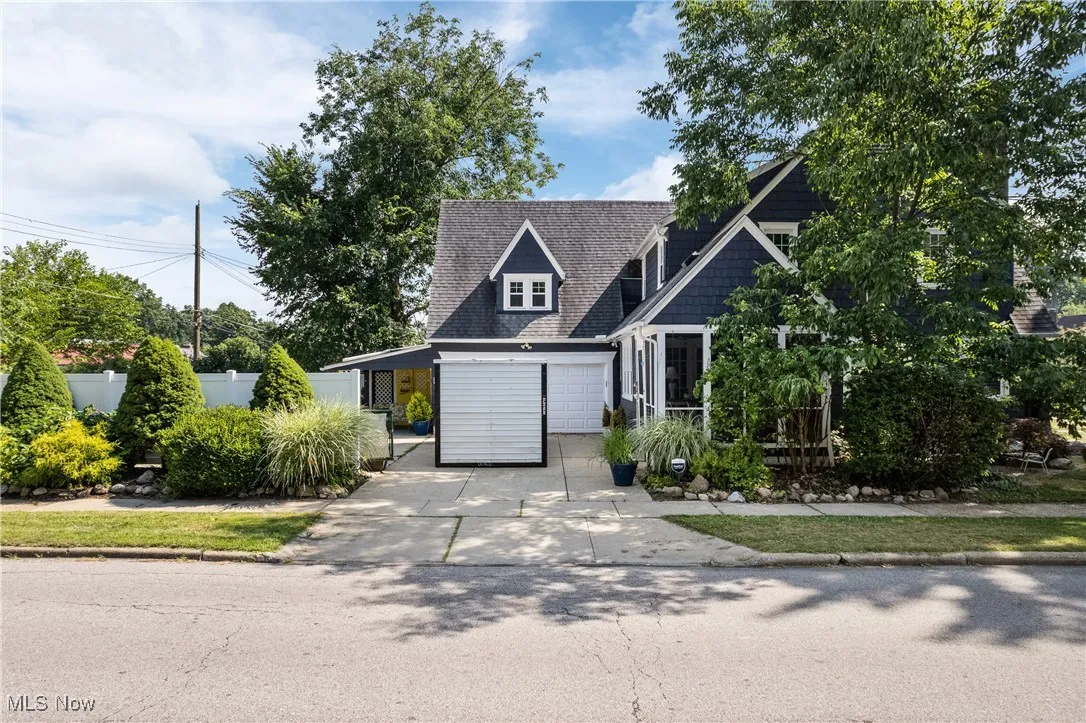 View of front of property with concrete driveway