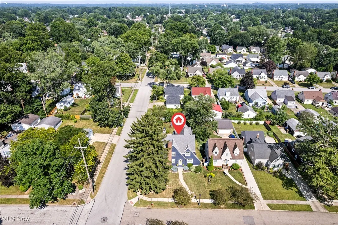 Aerial view of property's location featuring nearby suburban area