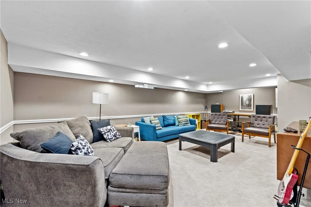 Living room featuring recessed lighting and carpet flooring
