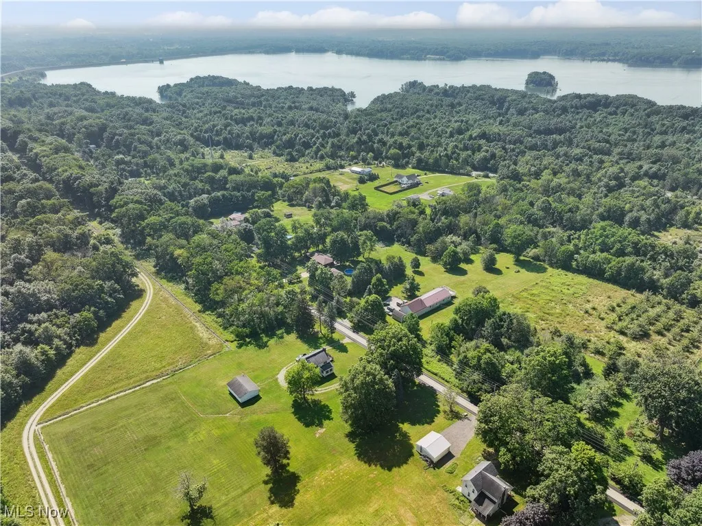 Aerial view of a nearby body of water and a forest