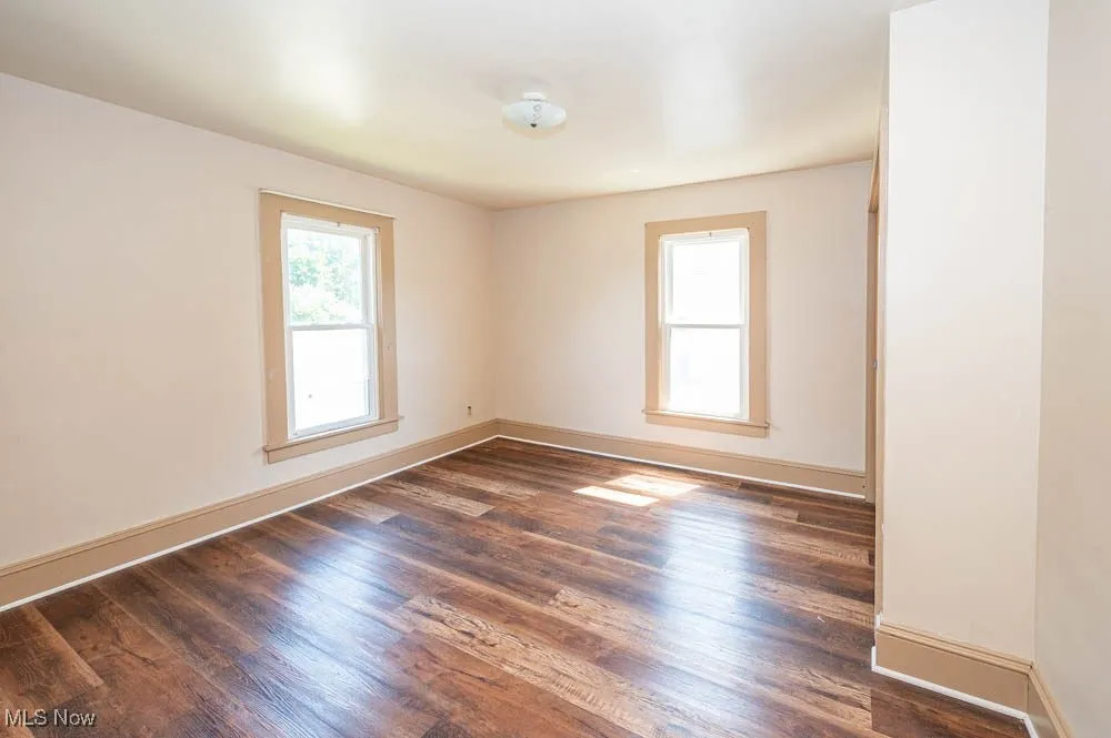 bedroom featuring dark wood finished floors