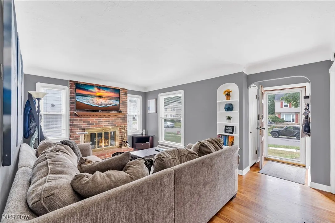 Living area featuring a fireplace and light wood-type flooring