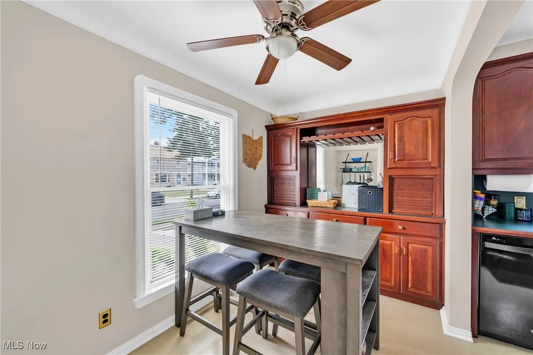 Dining space with baseboards and ceiling fan
