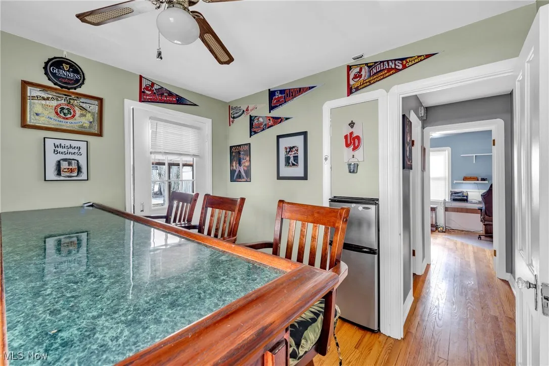 Dining area featuring ceiling fan and light wood-type flooring