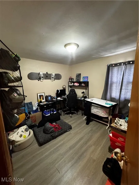 Home office featuring wood finished floors
