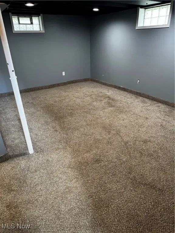 Basement featuring carpet flooring