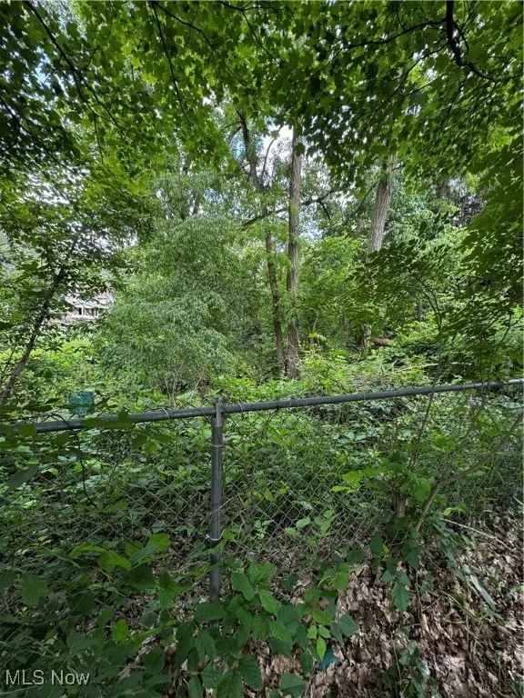 View of yard with a forest view