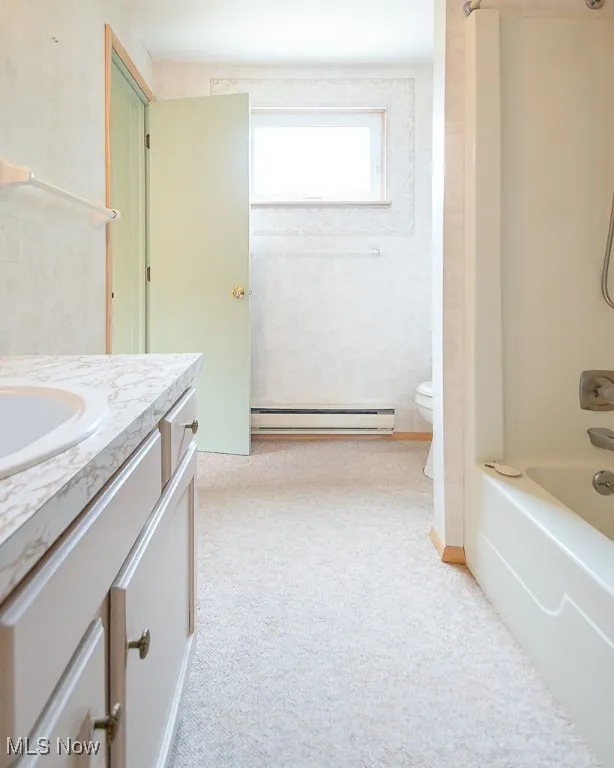 Bathroom featuring vanity, and shower / bathtub combination