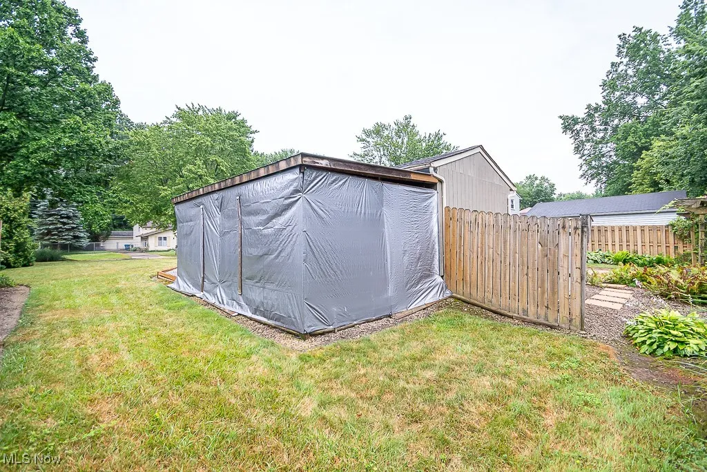 View of yard with a carport