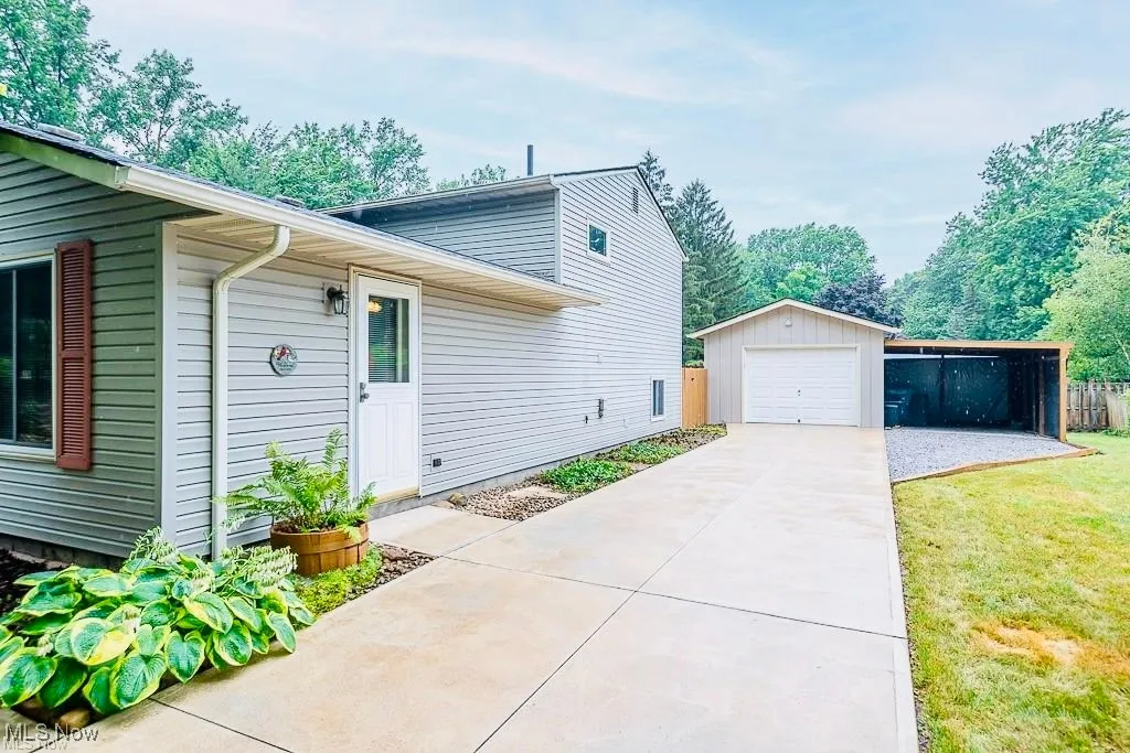 View of property exterior featuring driveway