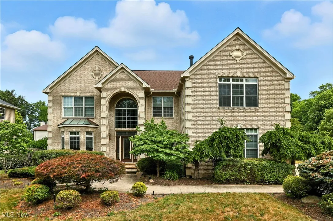 Traditional home with brick siding