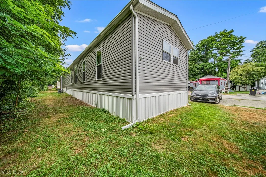 View of home's exterior featuring a lawn