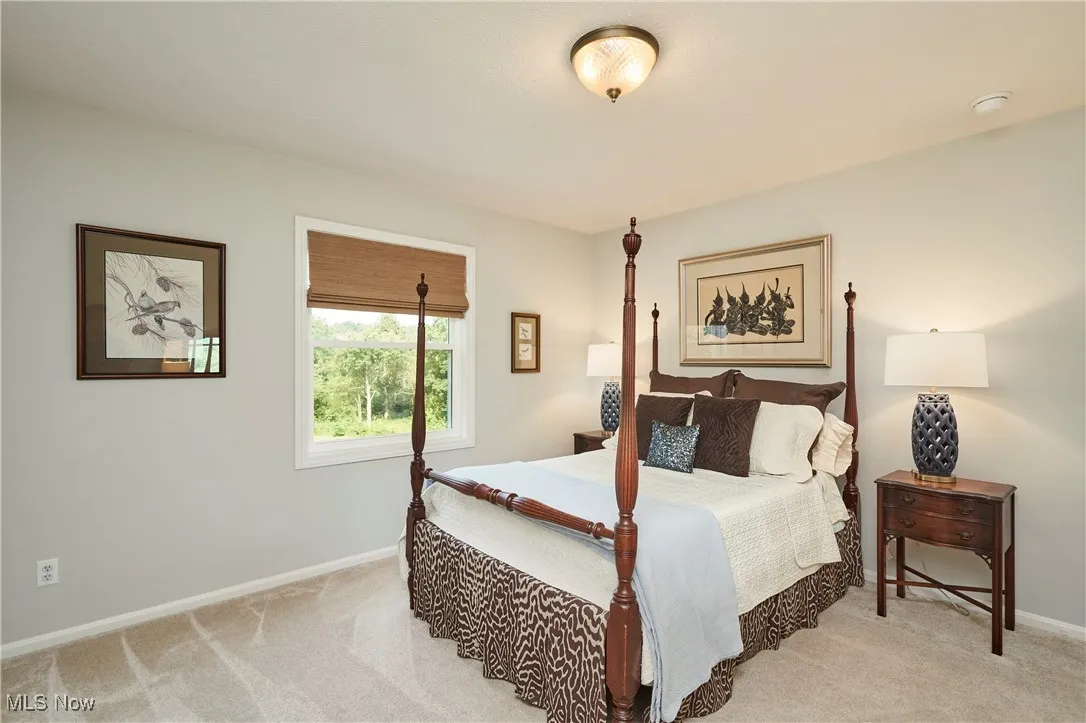 Carpeted bedroom with baseboards