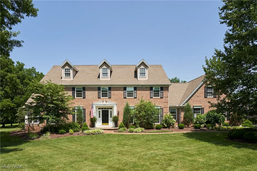 View of front of property with a front lawn and brick siding