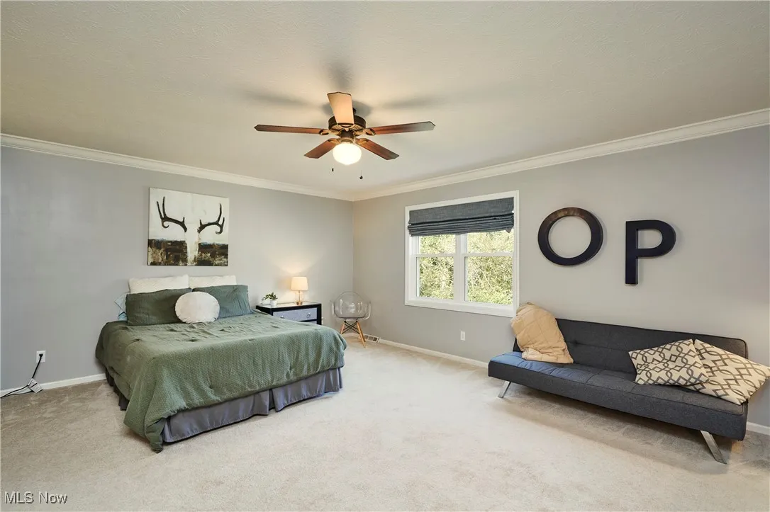 Addit'l Master Bedroom featuring crown molding and ceiling fan