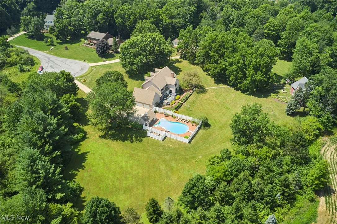 Aerial view of property and surrounding area featuring rural landscape